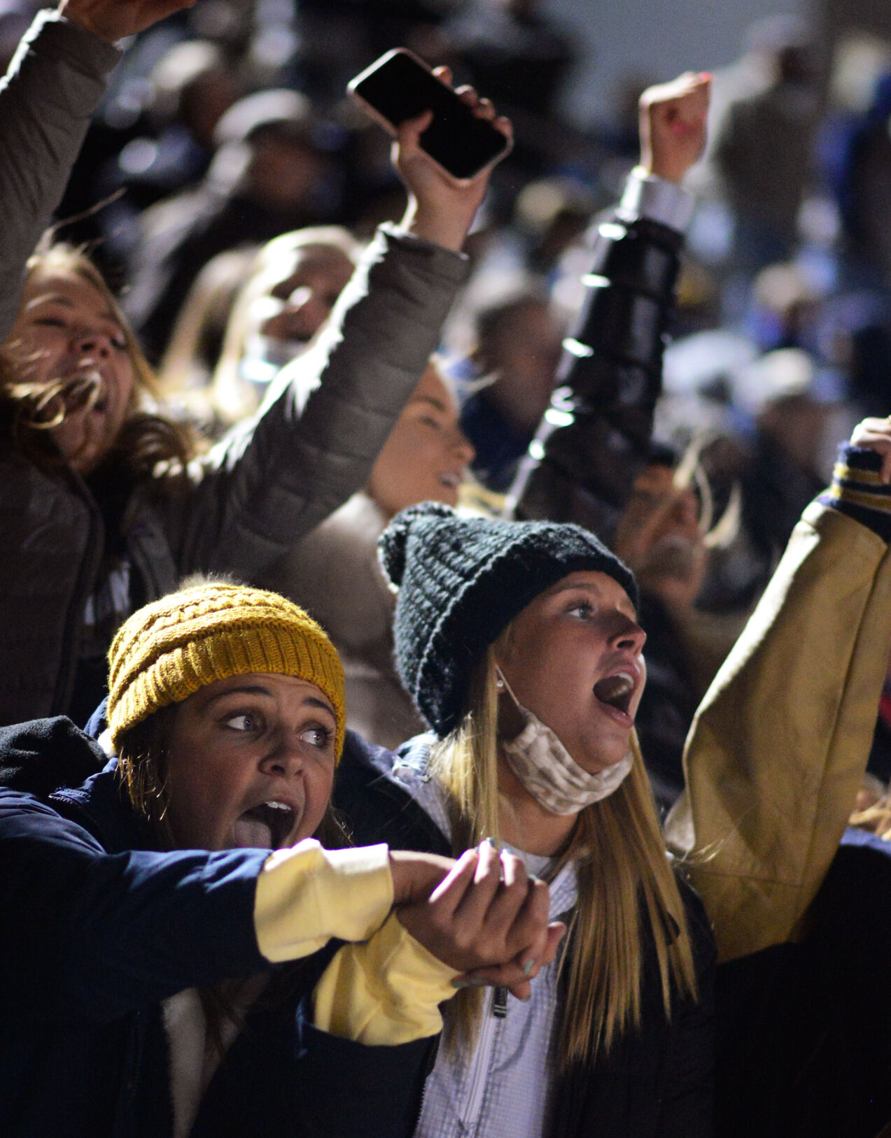 Grace Wilding cheers as the Helias student section erupts in excitement